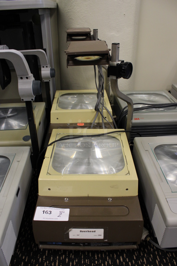 2 Poly Countertop Projectors. 15.5x17x23. 2 Times Your Bid! (2nd Floor: Room 220) - Image 1 of 5