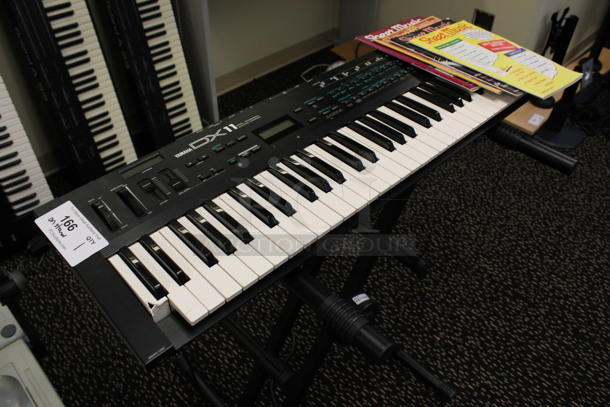 Yamaha Model DX11 Keyboard on Stand w/ 4 Music Books.120 Volts, 1 Phase. 35.5x11x2, 21x20x34. (2nd Floor: Room 220) - Image 2 of 10