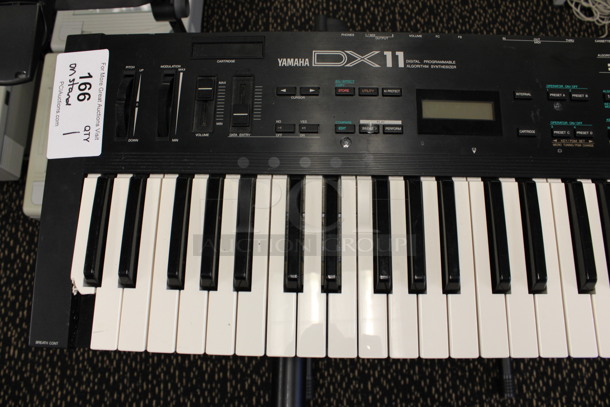 Yamaha Model DX11 Keyboard on Stand w/ 4 Music Books.120 Volts, 1 Phase. 35.5x11x2, 21x20x34. (2nd Floor: Room 220) - Image 7 of 10
