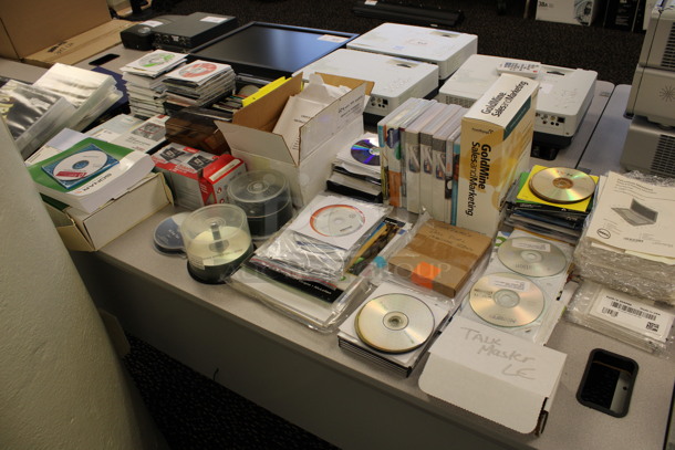 ALL ONE MONEY! Lot of Various CDs on Tabletop Including Autodesk Education Master Suite Case! (2nd Floor: Room 220)
