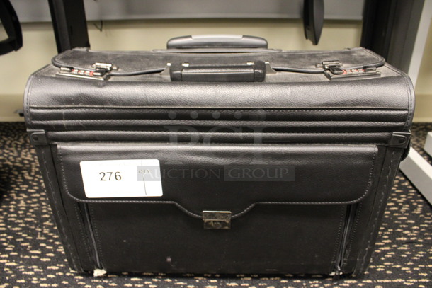 Black Lockable Briefcase Bag w/ Handle on Wheels. Does Not Have Combination. 19x9.5x14. (2nd Floor: Room 220)