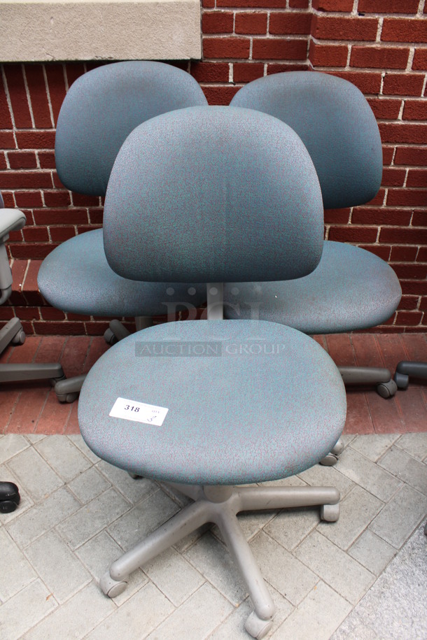 3 Patterned Blue Office Chairs on Casters. 21x22x39. 3 Times Your Bid! (Atrium)