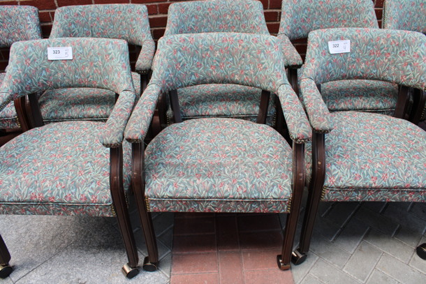 4 Floral Patterned Chairs w/ Arm Rests, Wood Patterned Legs and Nailhead Trim on Casters. 24x21x31. 4 Times Your Bid! (Atrium)
