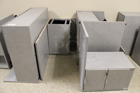 ALL ONE MONEY! Lot of Disassembled Gray Desk Set Up. Pieces; Corner Desk, Desk w/ 3 Drawer Filing Cabinet, Desk w/ 2 Drawer Cabinet and Hutch! 36x24x29, 36x36x29, 48x24x29, 48x24x38.5. (Hallways Straight Off Of Atrium)
