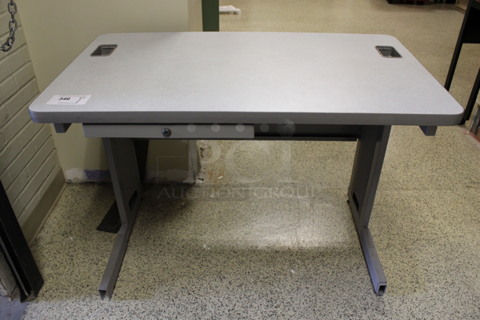 Gray Desk w/ Drawer. 42x24x30. (Hallways Straight Off Of Atrium)