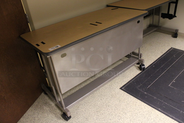 2 Wood Pattern Tables on Casters. 60x30x36. 2 Times Your Bid! (Hallways Straight Off Of Atrium) - Image 2 of 4