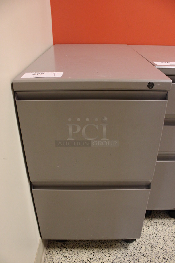 Gray Metal 2 Drawer Filing Cabinet on Casters. 15x28x28. (Hallway To The Right of Atrium Lobby)