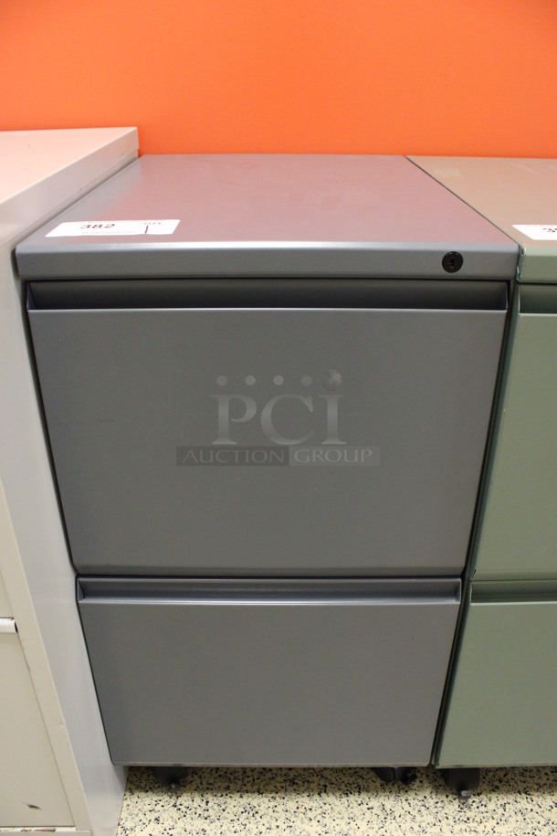 Gray Metal 2 Drawer Filing Cabinet on Casters. 15x22x28. (Hallway To The Right of Atrium Lobby)