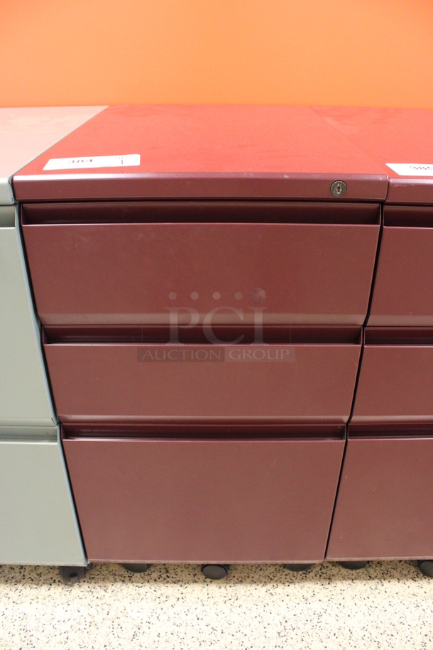 Maroon Metal 3 Drawer Filing Cabinet on Casters. 15x22x28. (Hallway To The Right of Atrium Lobby)