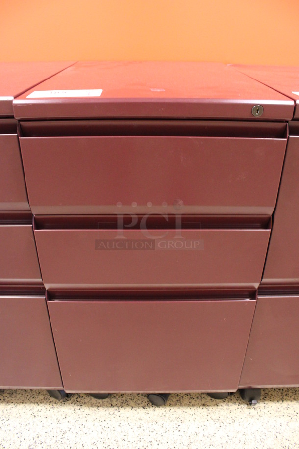 Maroon Metal 3 Drawer Filing Cabinet on Casters. 15x22x28. (Hallway To The Right of Atrium Lobby)