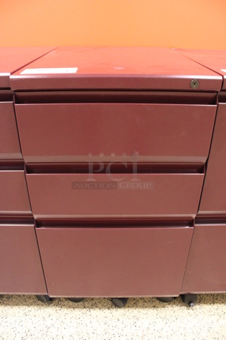 Maroon Metal 3 Drawer Filing Cabinet on Casters. 15x22x28. (Hallway To The Right of Atrium Lobby)