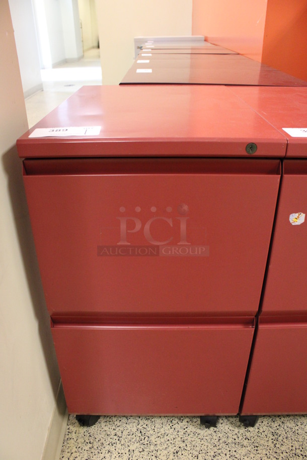 Red Metal 2 Drawer Filing Cabinet on Casters. 15x22x28. (Hallway To The Right of Atrium Lobby)