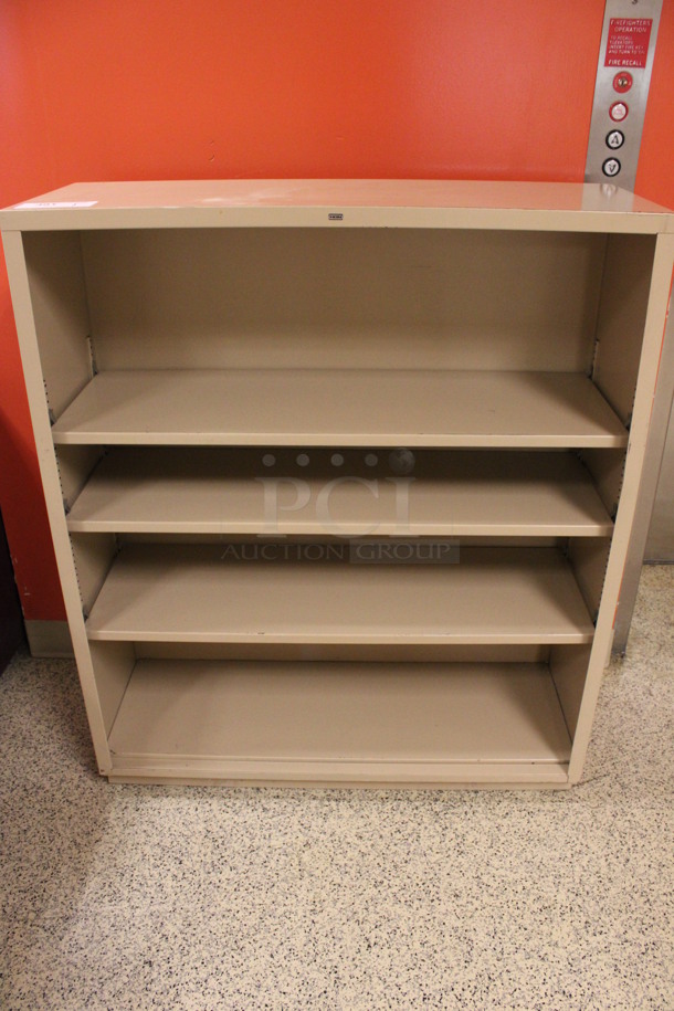 Hon Tan Metal Bookshelf. 34.5x13x41. (Hallway To The Right of Atrium Lobby) 