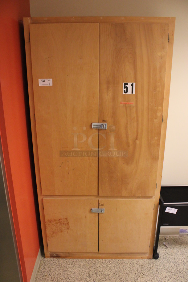 Wooden 4 Door Cabinet w/ Contents. 42x14x84. (Hallway To The Right of Atrium Lobby)