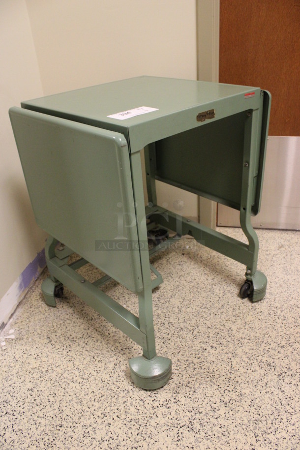 Green Metal Table on Casters. 20x18x27. (Hallway To The Right of Atrium Lobby) - Image 3 of 6