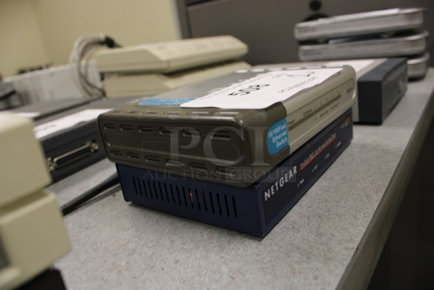 2 Units; DSS-5+ 10/100 Fast Ethernet Switch and Netgear WG102 ProSafe 802.1g Wireless Access Point. 5.5x4.5x1. 2 Times Your Bid! (Room 105) - Image 2 of 4