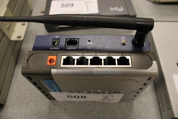 2 Units; DSS-5+ 10/100 Fast Ethernet Switch and Netgear WG102 ProSafe 802.1g Wireless Access Point. 5.5x4.5x1. 2 Times Your Bid! (Room 105) - Image 4 of 4