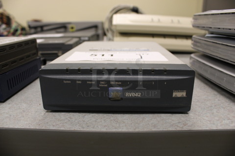 Cisco Systems RV042 Router. 5x8x1.5. (Room 105)