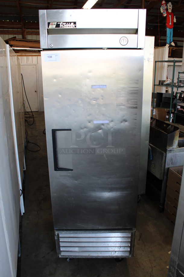 True Model T-23F Stainless Steel Commercial Single Door Reach In Freezer w/ Poly Coated Racks on Commercial Casters. 115 Volts, 1 Phase. 27x30x83. Tested and Working!