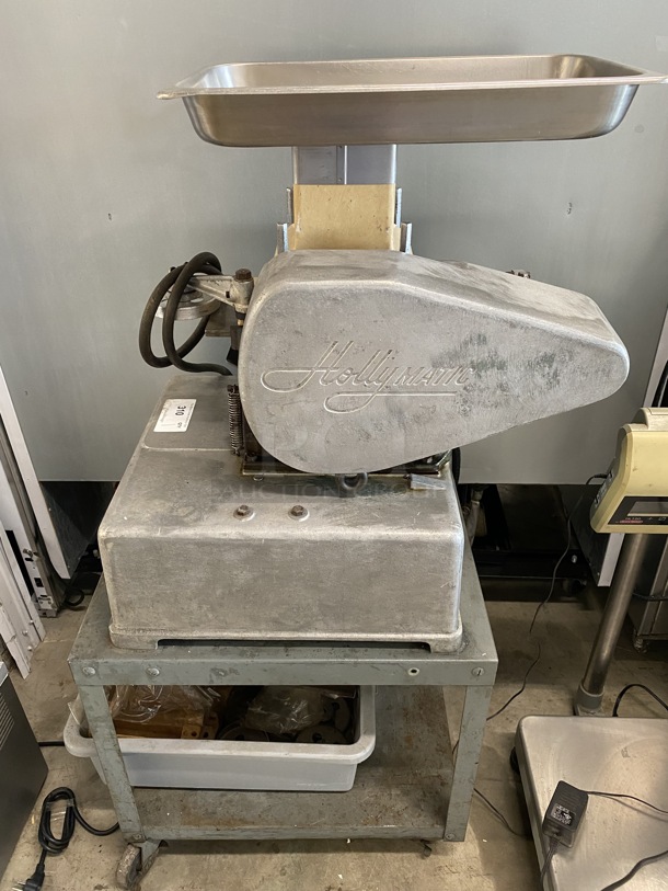 Hollymatic Metal Commercial Countertop Patty Former w/ Bin of Extra Pieces on Metal Stand w/ Commercial Casters. 115 Volts, 1 Phase. 20x30x53. Tested and Working!