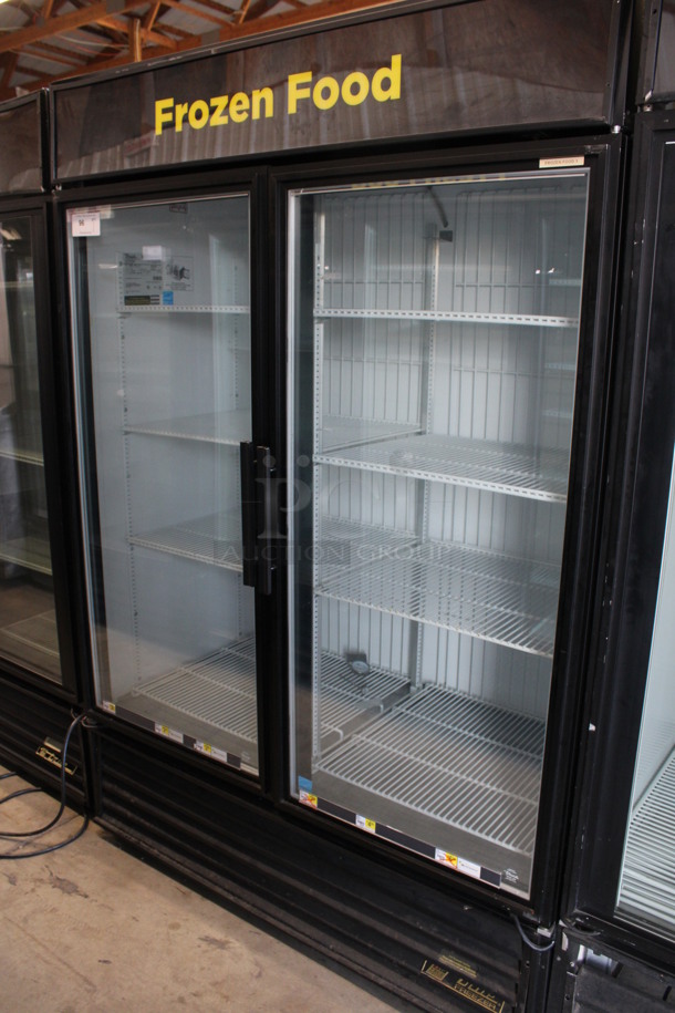 2013 True Model GDM-49F-LD ENERGY STAR Metal Commercial 2 Door Reach In Freezer Merchandiser w/ Poly Coated Racks. 115 Volts, 1 Phase. 54x31x79. Cannot Test Due To Plug Style