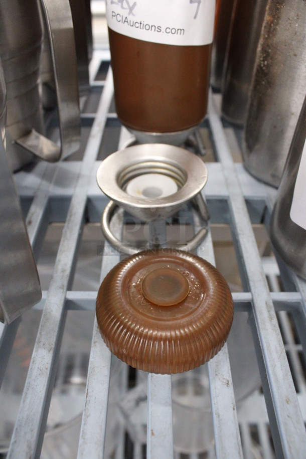 4 Brown Poly Condiment Bottles on Metal Stand. Comes w/ Extra Lid and Metal Piece. 2.5x2.5x7.5. 4 Times Your Bid! - Image 2 of 6