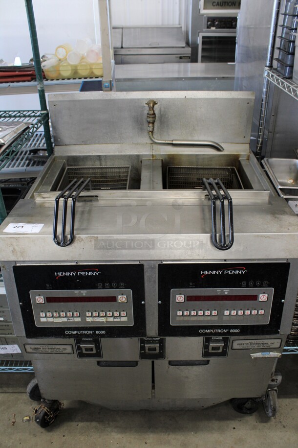 Henny Penny Model OFG-322 Stainless Steel Commercial Natural Gas Powered 2 Bay Deep Fat Fryer w/ 2 Metal Fry Baskets and Filtration System on Commercial Casters. 170,000 BTU. 33.5x33.5x45