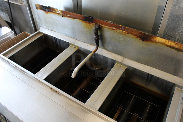 Henny Penny Model OFG-323 Stainless Steel Commercial Propane Gas Powered 3 Bay Deep Fat Fryer w/ Filtration System on Commercial Casters. 255,000 BTU. 49.5x33.5x45 - Image 3 of 8