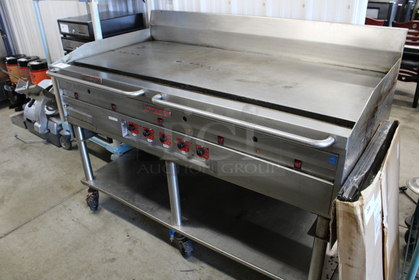WOW! MagiKitch'n Stainless Steel Commercial Natural Gas Powered Chrome Top Flat Top Griddle w/ Thermostatic Controls and Under Shelf on Commercial Casters. 60x34x43