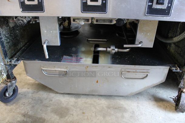 Henny Penny Model OFG-322 ENERGY STAR Stainless Steel Commercial Propane Gas Powered 4 Bay Deep Fat Fryer w/ 2 Metal Fry Baskets and Filtration System on Commercial Casters. 170,000 BTU. 67x33.5x44 - Image 9 of 10