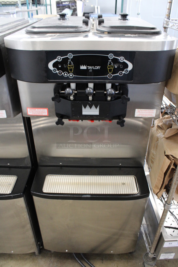 SWEET! 2012 Taylor Model C713-33 Stainless Steel Commercial Floor Style Water Cooled 2 Flavor w/ Twist Soft Serve Ice Cream Machine on Commercial Casters. 208-230 Volts, 3 Phase. 25.5x37x60