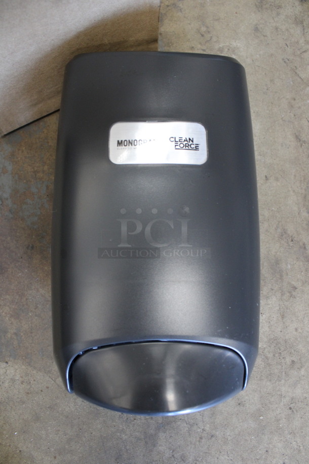 BRAND NEW IN BOX! Monogram Gray Poly Wall Mount Soap Dispenser. 6x4.5x10 - Image 1 of 4