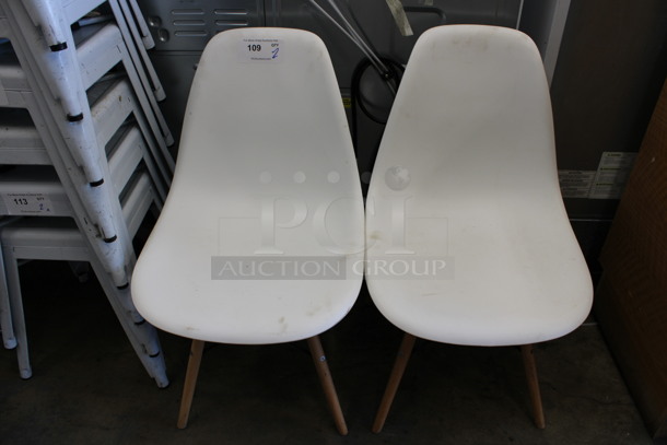 2 White Poly Dining Height Chairs on Wood Pattern Legs. 18x16x32. 2 Times Your Bid!