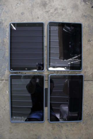 4 Apple Model A1474 9.5" iPads in Cases. See Pictures for Glass Damage. 4 Times Your Bid!