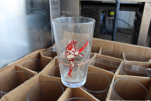 21 Beverage Glasses w/ Football Player Logo. 3.5x3.5x6. 21 Times Your Bid!