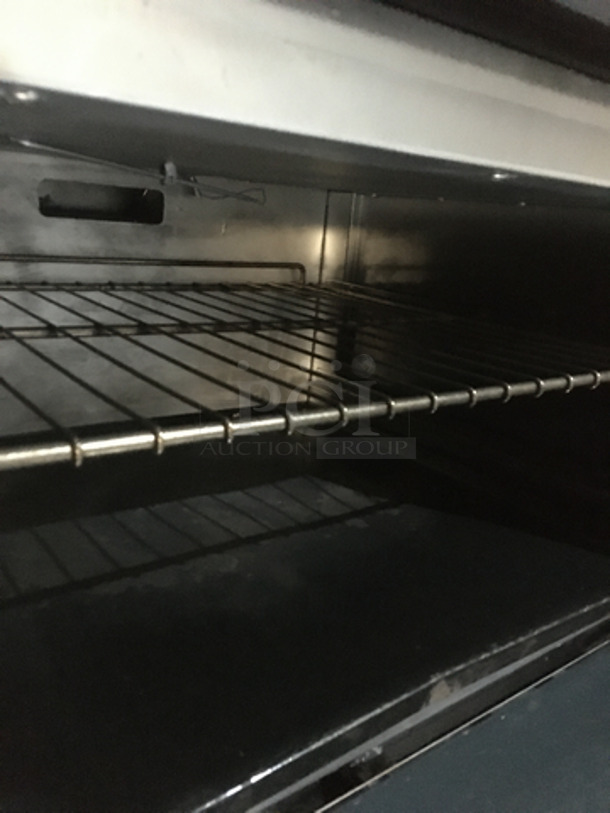 FABULOUS! American Range Commercial Natural Gas Powered 10 Burner Stove! With 2 Full Size Ovens Underneath! With Backsplash & Overhead Salamander Shelf! All Stainless Steel! On Casters! Working When Removed!  - Image 8 of 10