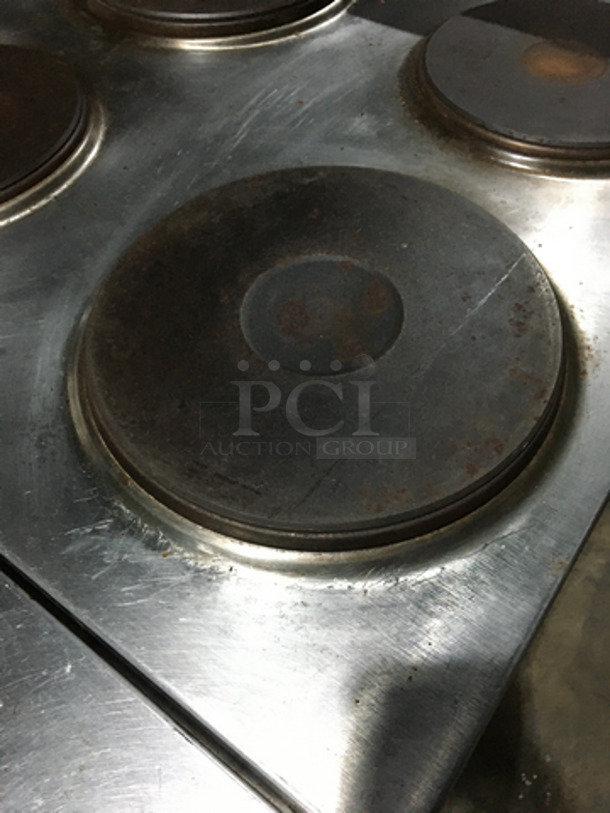 Garland Commercial Electric Powered 6 Burner Stove! With Full Size Oven Underneath! With Backsplash! All Stainless Steel! On Casters!
 - Image 6 of 10