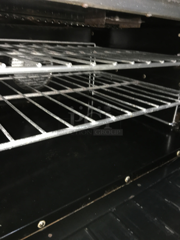 Garland Commercial Electric Powered 6 Burner Stove! With Full Size Oven Underneath! With Backsplash! All Stainless Steel! On Casters!
 - Image 8 of 10