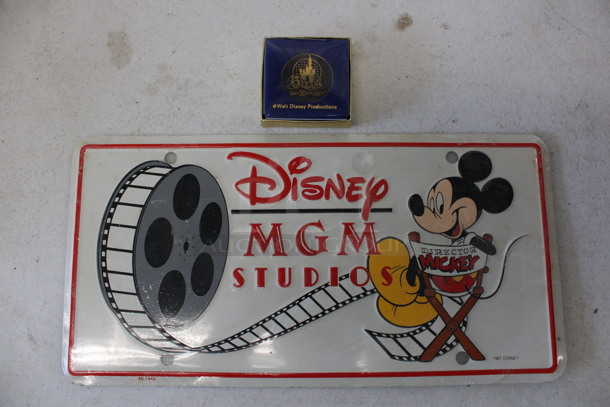 ALL ONE MONEY! Lot of Disney Items; 15 Anniversary Coin and License Plate. includes 12x6 - Image 1 of 3