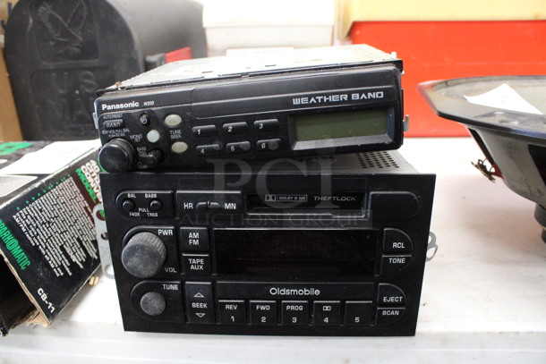 2 Various Radios; Panasonic W200 and Oldsmobile. Includes 7x7x3. 2 Times Your Bid!
