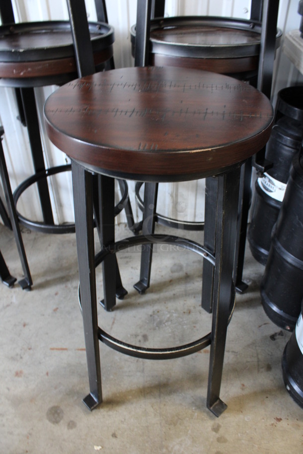 2 Black Metal Stools w/ Wood Pattern Round Seats and Footrest Bar. 14x14x29.5. 2 Times Your Bid!