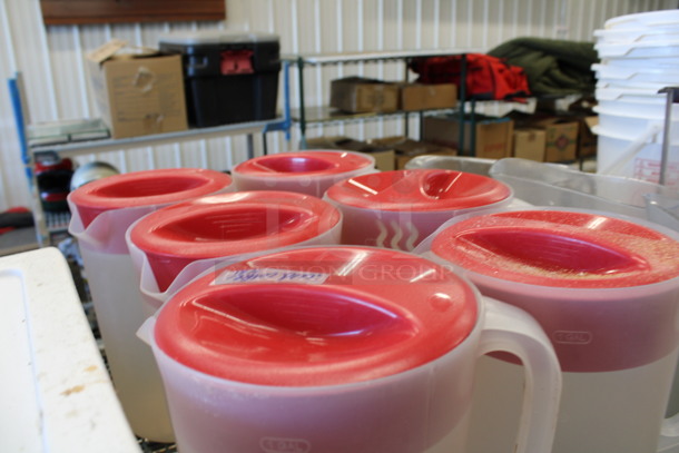 6 Clear Poly Pitchers w/ Red Lids. 8.5x6.5x10.5. 6 Times Your Bid! - Image 2 of 3