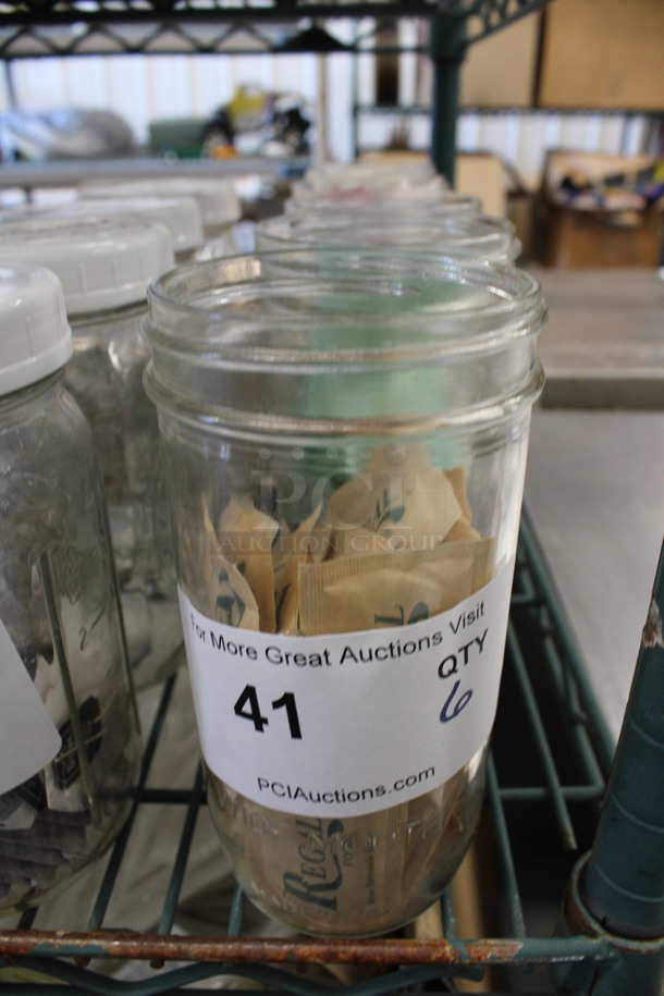 6 Glass Jars w/ Contents. 3.5x3.5x6.5. 6 Times Your Bid! - Image 1 of 2