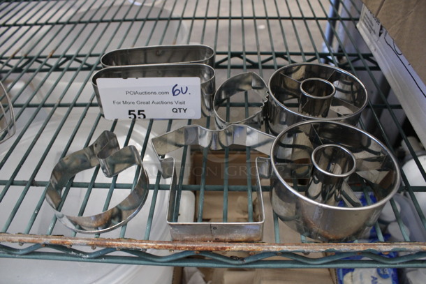 6 Various Metal Dough Cutters including Helmet and Shirt. Includes 4.5x4.5x1. 6 Times Your Bid!
