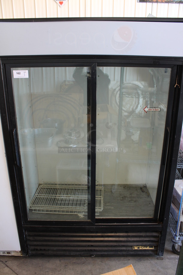 True Model GDM-45 Metal Commercial Double Door Reach In Cooler Merchandiser w/ Poly Coated Racks. 115 Volts, 1 Phase. 51.5x30x79. Tested and Working!