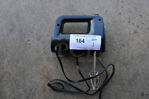 Black Hand Mixer w/ 2 Metal Attachments. 3.5x7x10. Tested and Working!