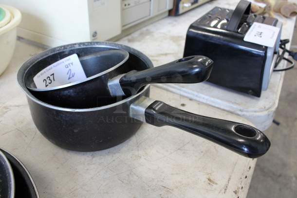 2 Various Metal Sauce Pots. Includes 14x7.5x3.5. 2 Times Your Bid!