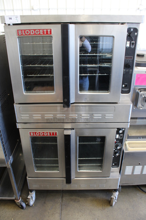 2 2015 Blodgett Stainless Steel Commercial Natural Gas Powered Full Size Convection Ovens w/ View Through Doors, Metal Oven Racks and Thermostatic Controls on Commercial Casters. 38x38x73. 2 Times Your Bid