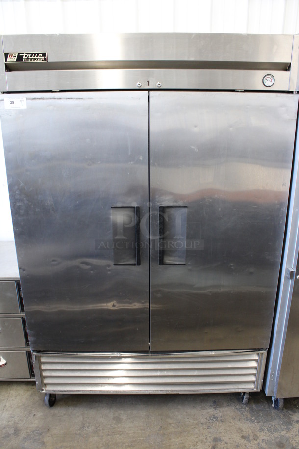 True Model T-49F Stainless Steel Commercial 2 Door Reach In Freezer on Commercial Casters. 115 Volts, 1 Phase. 54x30x84. Tested and Powers On But Does Not Get Cold