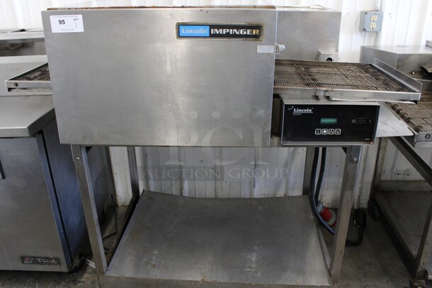 Lincoln Impinger Stainless Steel Commercial Electric Powered Conveyor Pizza Oven on Metal Stand w/ Commercial Casters. 480 Volts, 3 Phase. 56x39x54